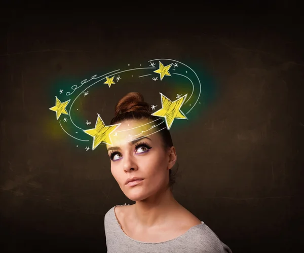 Dívka se žlutými hvězdami krouží kolem její hlavy ilustrace — Stock fotografie