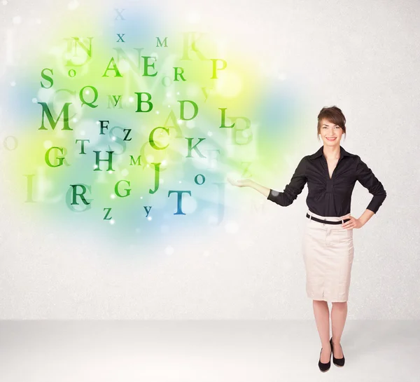 Business women with glowing letter concept — Stock Photo, Image