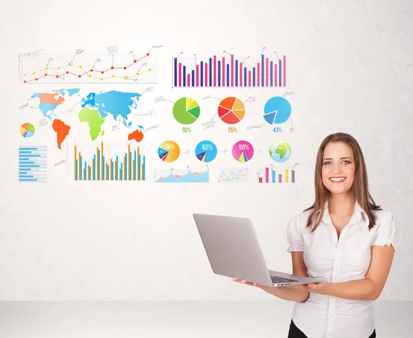 Business woman with colorful graphs and charts — Stock Photo, Image