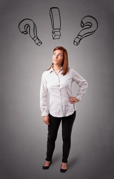 Young lady thinking with question marks overhead — Stock Photo, Image