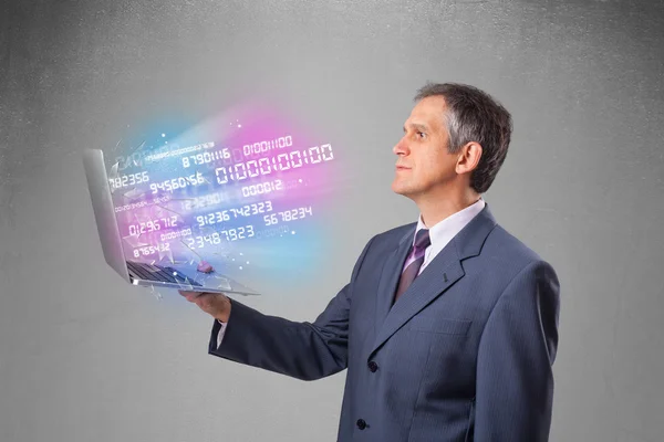 Businessman holding notebook with exploding data and numbers — Stock Photo, Image