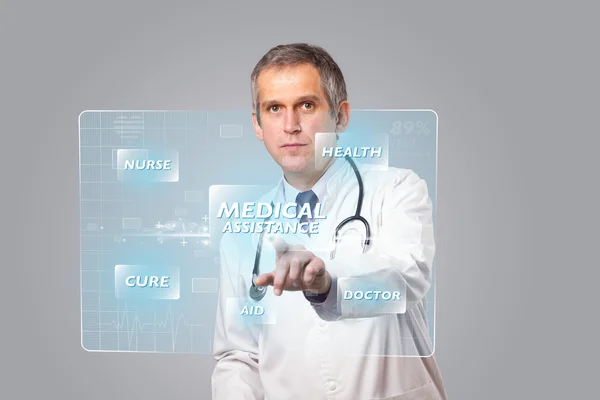 Middle aged doctor pressing modern medical type of button — Stock Photo, Image