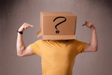 Young man gesturing with a cardboard box on his head with questi clipart