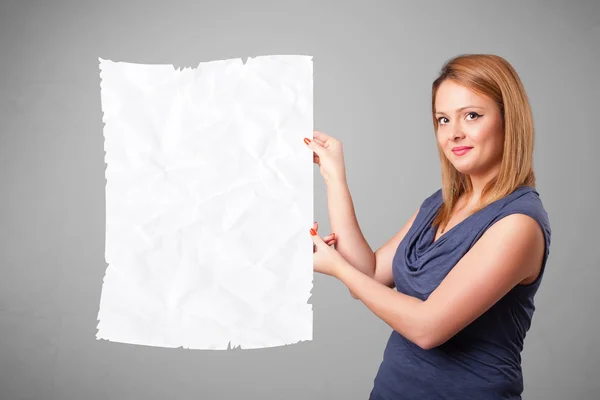 Young girl holding crumpled white paper copy space — Stock Photo, Image