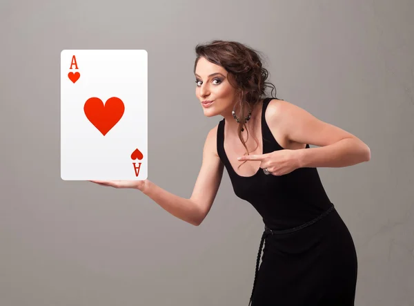 Beautifu woman holding a red heart ace — Stock Photo, Image