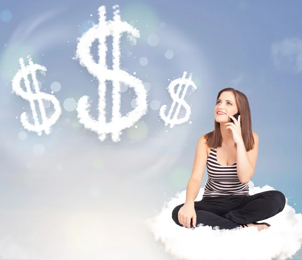 Young woman sitting on cloud next to cloud dollar signs — Stock Photo, Image