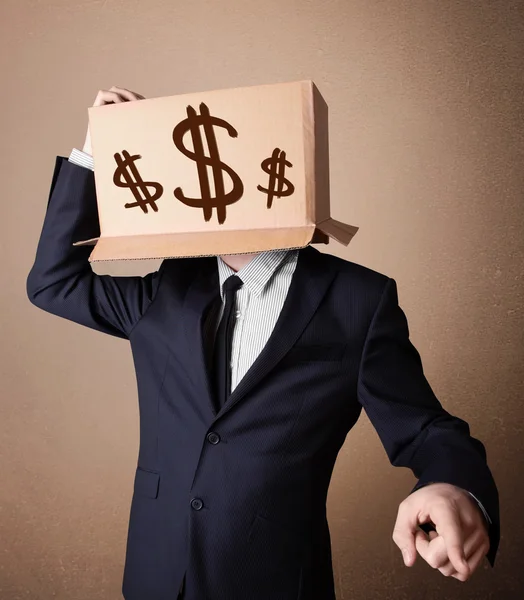 Businessman gesturing with a cardboard box on his head with doll — Stock Photo, Image