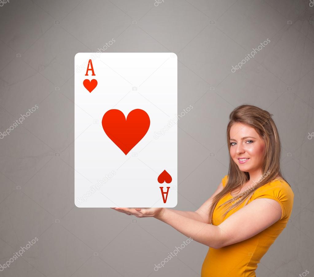 Beautifu woman holding a red heart ace