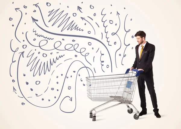 Businessman with shopping cart — Stock Photo, Image