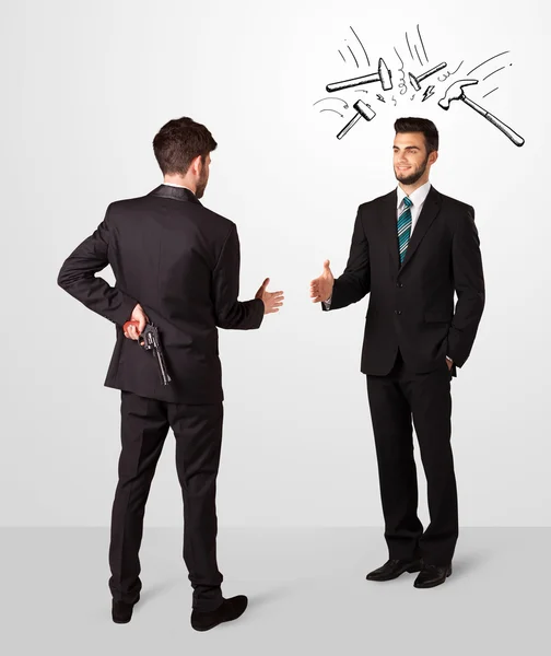 Businessman hiding a weapon — Stock Photo, Image