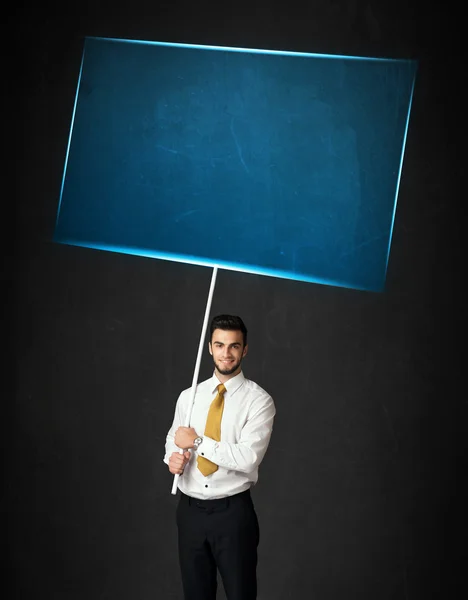 Empresário com placa azul — Fotografia de Stock