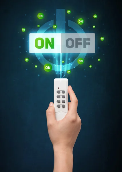 Hand with remote control and on-off signals
