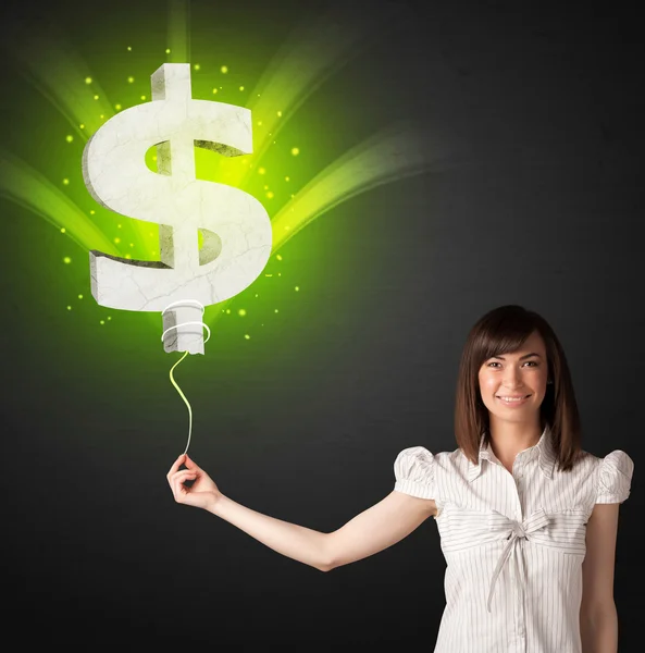 Businesswoman with a dollar sign balloon — Stock Photo, Image