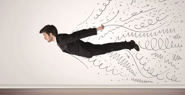 Hombre de negocios volando con líneas dibujadas a mano saliendo — Foto de Stock
