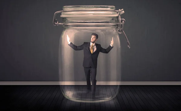 Businessman trapped into a glass jar concept — Stock Photo, Image