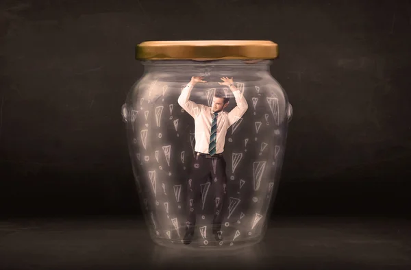 Business man trapped in jar with exclamation marks concept — Stock Photo, Image