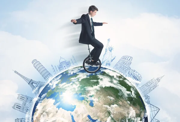 Man riding unicycle around the globe with major cities — Stock Photo, Image