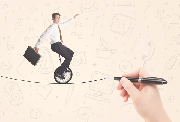 Businessman riding monocycle on a rope drawn by hand — Stock Photo, Image