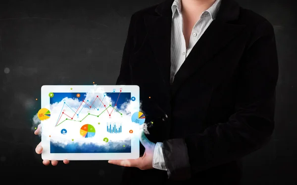 Person holding a touchpad with cloud technology and charts — Stock Photo, Image