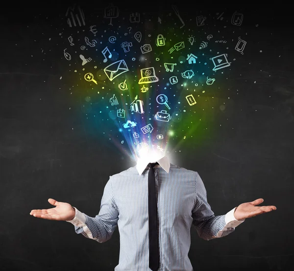 Business man with glowing media icons exploding head — Stock Photo, Image