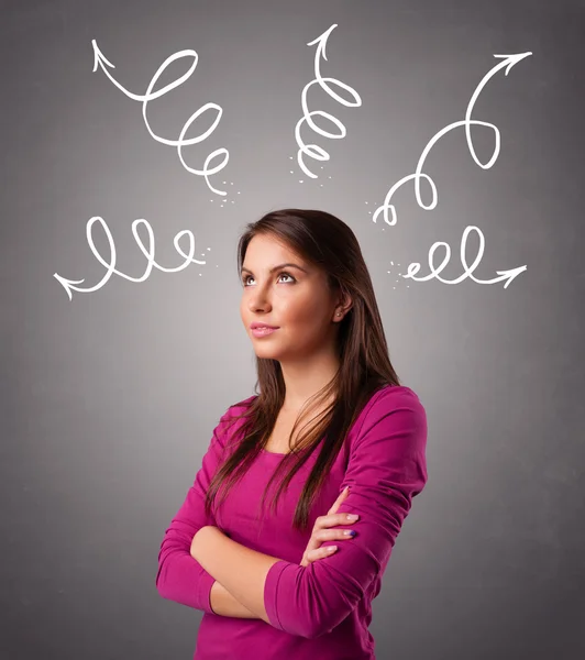 Young woman thinking with arrows overhead — Stock Photo, Image
