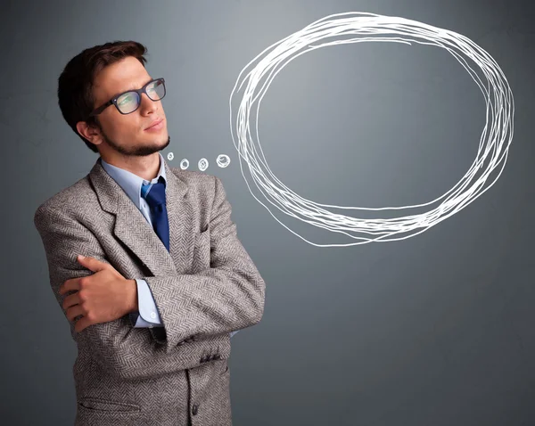 Good-looking man thinking about speech or thought bubble with co — Stock Photo, Image