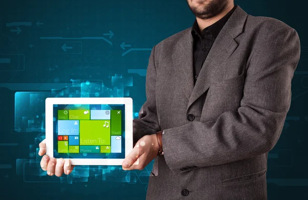 Businessman holding a tablet with modern software operational sy — Stock Photo, Image