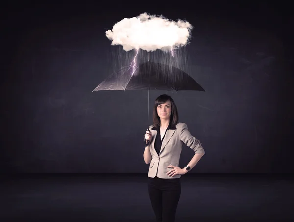 Businesswoman standing with umbrella and little storm cloud — Stock Photo, Image