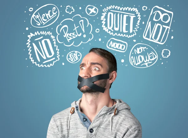 Young man with glued mouth and thought clouds — Stock Photo, Image