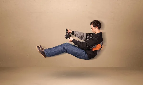 Happy funny man driving a flying car concept — Stock Photo, Image