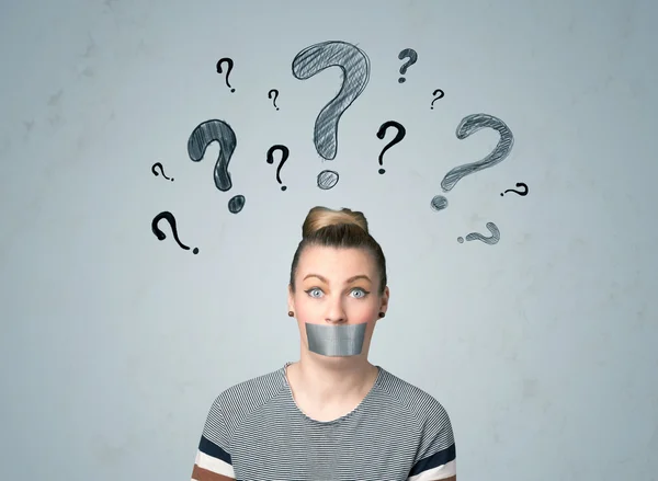 Young woman with glued mouth and question mark symbols — Stock Photo, Image