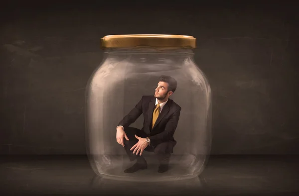 Businessman shut into a glass jar concept — Stock Photo, Image