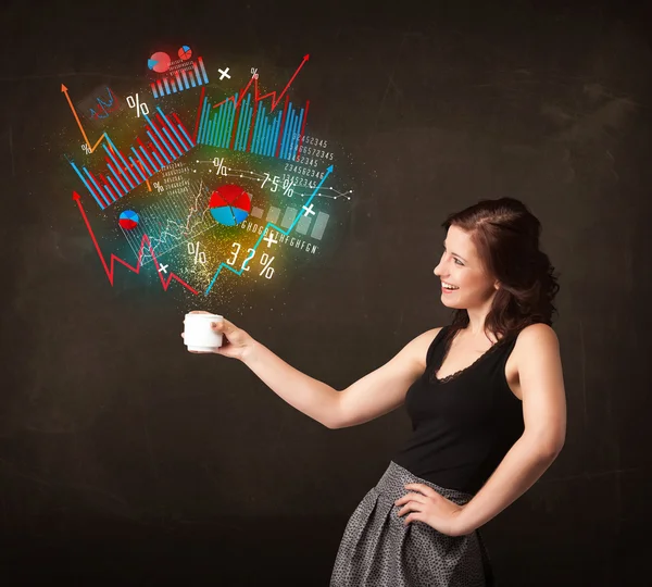 Businesswoman holding a white cup with diagrams and graphs — Stock Photo, Image