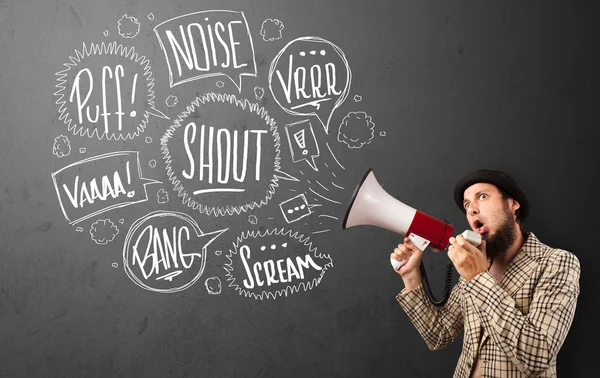 Guy in suit yelling into megaphone and hand drawn speech bubbles — Stock Photo, Image