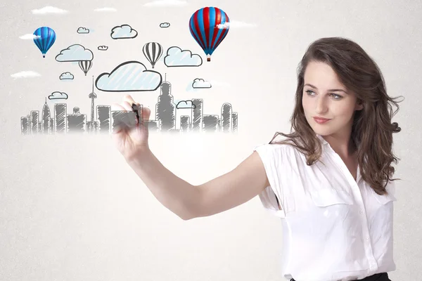 Hübsche Frau skizziert Stadtbild mit bunten Luftballons — Stockfoto