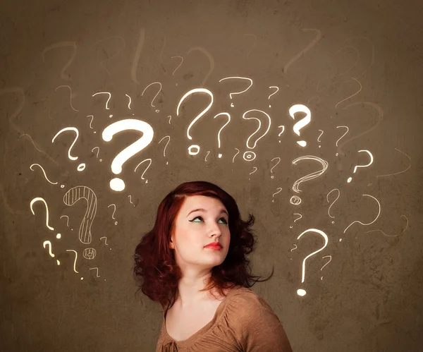 Girl with question mark symbols around her head — Stock Photo, Image