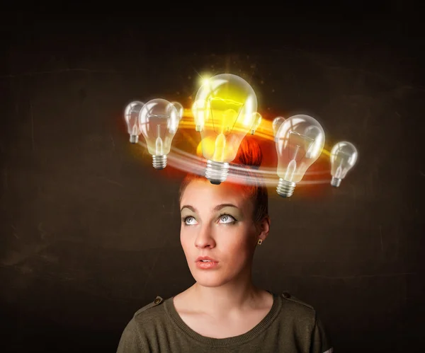 Woman with light bulbs circleing around her head — Stock Photo, Image
