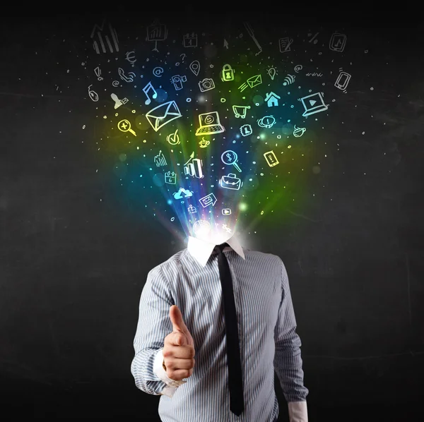 Business man with glowing media icons exploding head — Stock Photo, Image