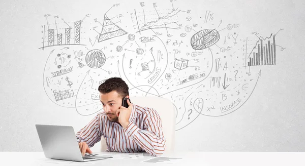 Business man at desk with hand drawn charts — Stock Photo, Image