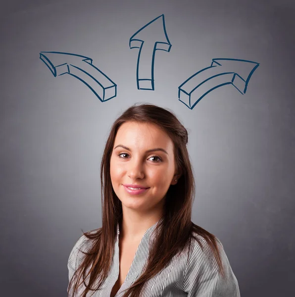 Pretty lady thinking with arrows overhead — Stock Photo, Image