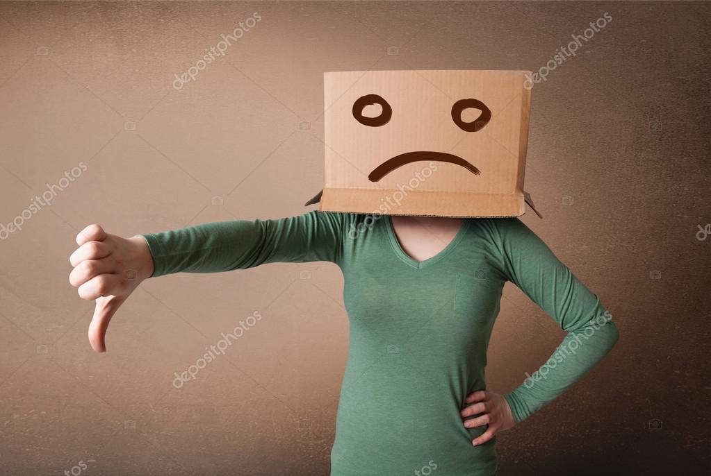 Young girl gesturing with brown cardboard box on her head with s Stock