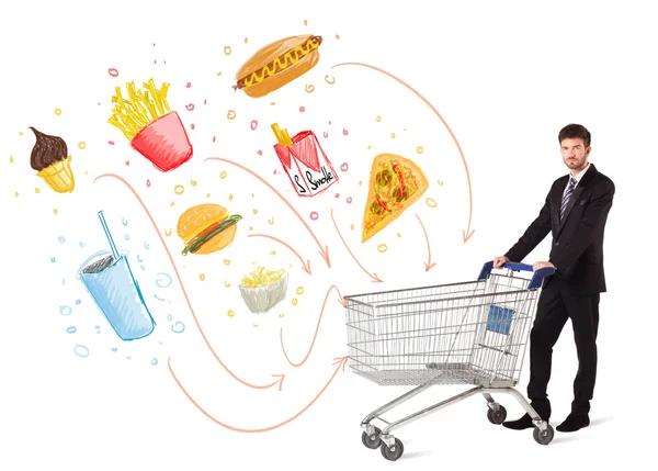 Man with shopping cart with toxic junk food — Stock Photo, Image