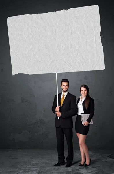 Business couple with blank booklet paper — Stock Photo, Image