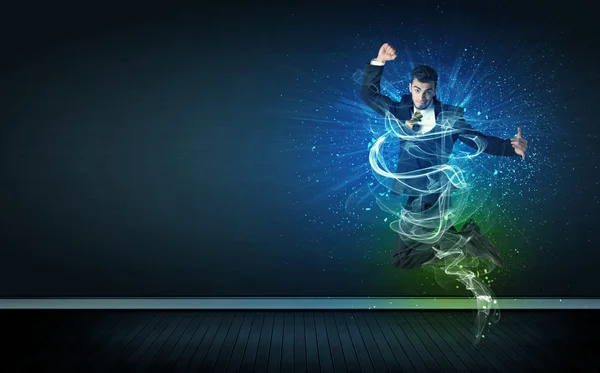 Talented cheerful businessman jumping with glowing energy lines — Stock Photo, Image