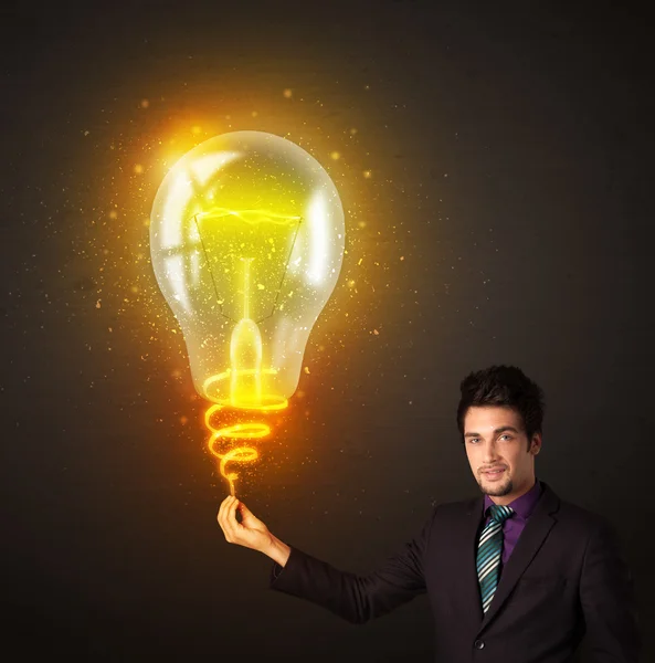 Businessman with an idea bulb — Stock Photo, Image