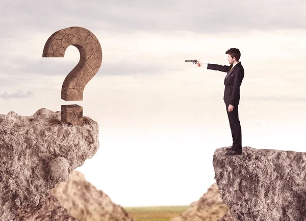 Businessman on rock mountain with a question mark — Stock Photo, Image