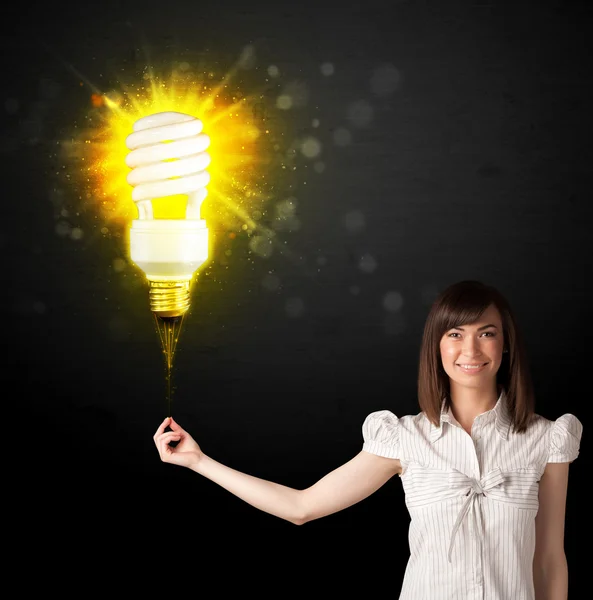 Businesswoman with an eco-friendly  bulb — Stock Photo, Image