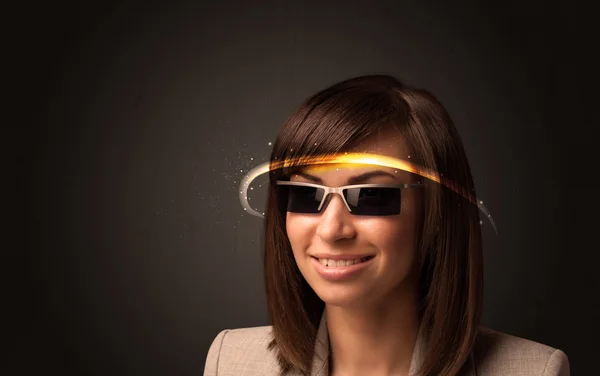 Pretty woman looking with futuristic high tech glasses — Stock Photo, Image