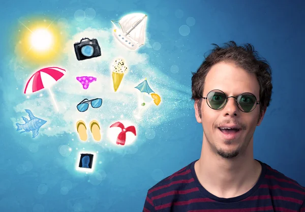 Happy joyful man with sunglasses looking at summer icons — Stock Photo, Image