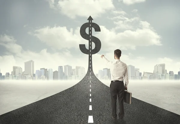 Business man on road heading toward a dollar sign — Stock Photo, Image